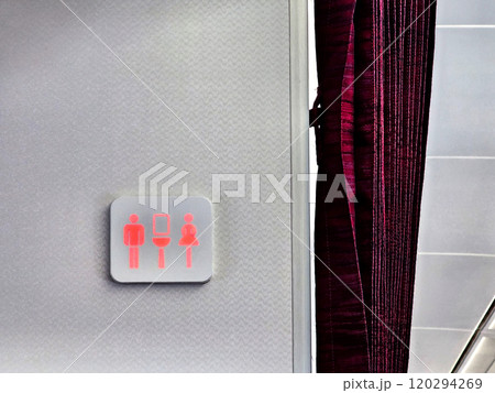 Red sign of lavatory in the airplane Red sign of lavatory in the airplane 120294269