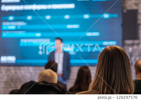 Business conference with speaker and audience Business conference with speaker and audience 120297576
