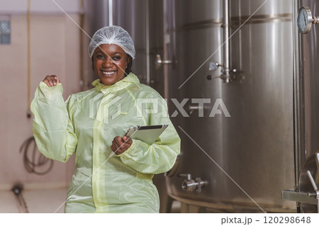 Winemaker working in modern large winery factory liquor drink industry quality. Staff inspecting wine in modern wine factory. Winery manufacturing quality control. Alcohol and wine winemaking process 120298648