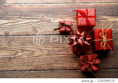 Assorted artisanal gift boxes on wooden background. 120299513
