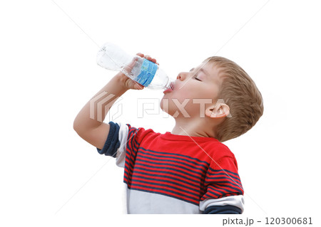 Young Child Refreshing Himself by Drinking Water From a Bottle in a Bright Setting Young Child Refreshing Himself by Drinking Water From a Bottle in a Bright Setting 120300681
