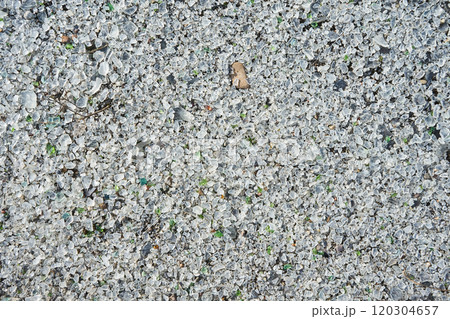 Many small pieces of broken shattered glass of different colors. 120304657
