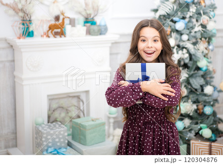 waiting for santa. Xmas. Cute little child girl with xmas present. happy new year. Christmas shopping. christmas family holiday. The morning before Xmas. Find presents online 120304876