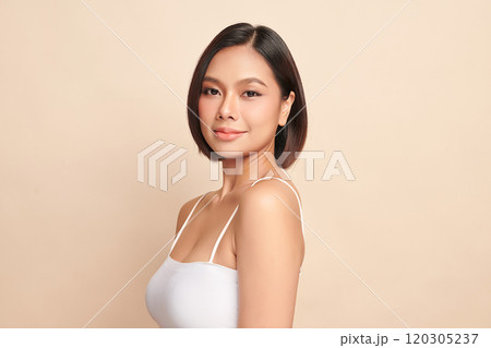 Beautiful young asian woman with clean fresh skin on beige background, Face care, Facial treatment, Cosmetology, beauty and spa, Asian women portrait. Beautiful young asian woman with clean fresh skin on beige background, Face care, Facial treatment, Cosmetology, beauty and spa, Asian women portrait. 120305237