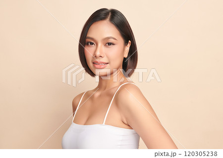 Beautiful young asian woman with clean fresh skin on beige background, Face care, Facial treatment, Cosmetology, beauty and spa, Asian women portrait. Beautiful young asian woman with clean fresh skin on beige background, Face care, Facial treatment, Cosmetology, beauty and spa, Asian women portrait. 120305238