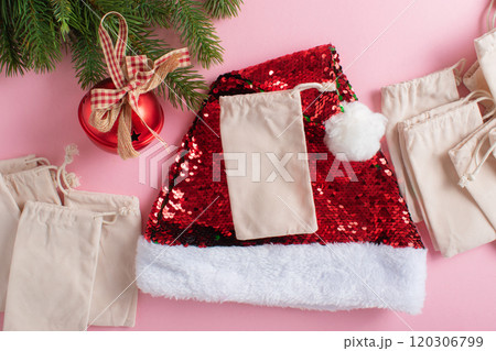Christmas Advent calendar with gift velvet bags on a light pink background. Christmas Advent calendar with gift velvet bags on a light pink background. 120306799