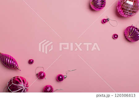 A set of minimalistic Christmas decorations made in one color on a light pink background. 120306813