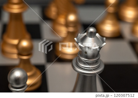 Chessboard with close up of chess game pieces Chessboard with close up of chess game pieces 120307512