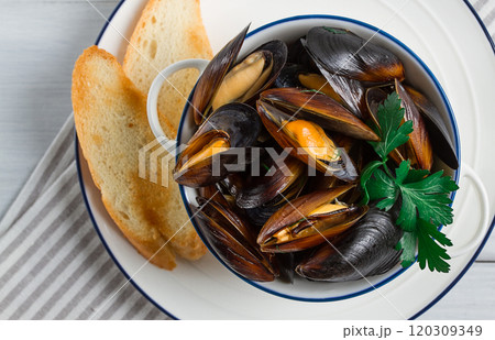 Fresh, Boiled mussels, Black Sea, with white bread, on a white wooden table, no people, 120309349