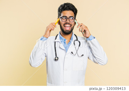 Irritated stressed doctor man talking on two mobile phones having conversation conflict quarrel Irritated stressed doctor man talking on two mobile phones having conversation conflict quarrel 120309413