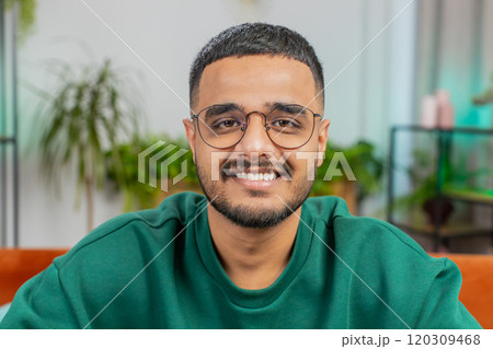 Happy Indian man smiling friendly, glad expression, feel satisfied concept good news celebrate win Happy Indian man smiling friendly, glad expression, feel satisfied concept good news celebrate win 120309468