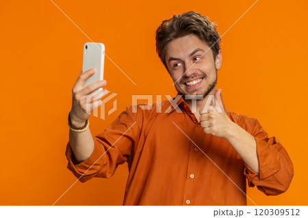 Happy young man blogger take portrait selfie record video call online with social media subscribers 120309512