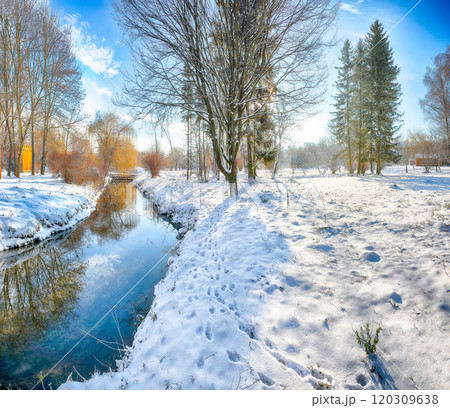 Colorful landscape with snowy trees, beautiful frozen river with reflection in water. Colorful landscape with snowy trees, beautiful frozen river with reflection in water. 120309638