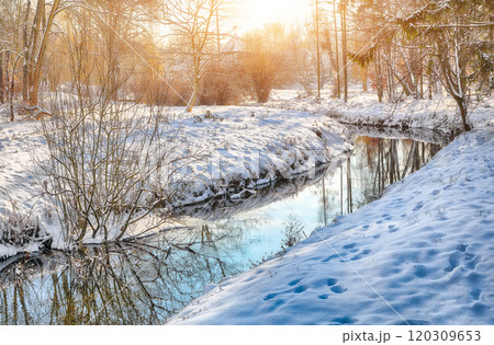 Colorful landscape with snowy trees, beautiful frozen river with reflection in water. Colorful landscape with snowy trees, beautiful frozen river with reflection in water. 120309653