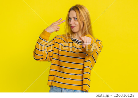 Young woman pointing at eyes and camera show I am watching you gesture spying, watching on someone Young woman pointing at eyes and camera show I am watching you gesture spying, watching on someone 120310128