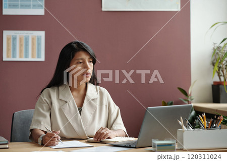 Watching online video on laptop screen Watching online video on laptop screen 120311024