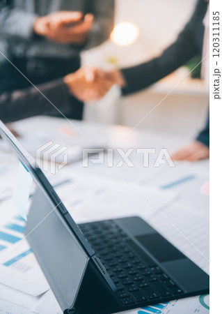 Handshake in agreement against young business people in board room meeting 120311185