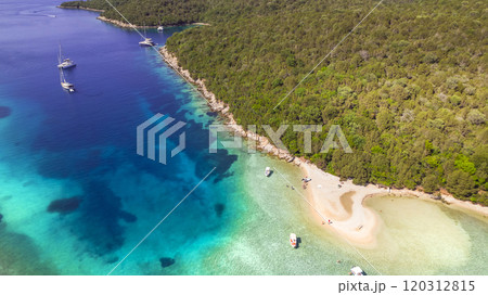 Epirus, Greece. Sivota - stunning aerial drone video of turquoise sea known as Blue Lagoon and unique beach Bella Vraka.  120312815