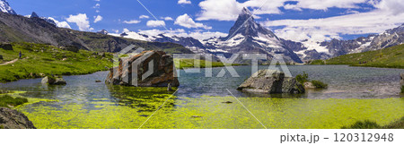 famous hiking routes in Switzerland , Valais canton - five most beautiful mountain lakes in Zermatt. Panoramic view of Stellisee lake and Matterhorn iconic mountain famous hiking routes in Switzerland , Valais canton - five most beautiful mountain lakes in Zermatt. Panoramic view of Stellisee lake and Matterhorn iconic mountain 120312948