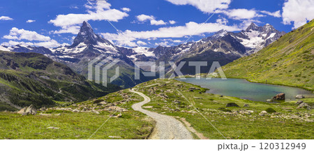 famous hiking routes in Switzerland , Valais canton - five most beautiful mountain lakes in Zermatt. Panoramic view of Stellisee lake and Matterhorn iconic mountain famous hiking routes in Switzerland , Valais canton - five most beautiful mountain lakes in Zermatt. Panoramic view of Stellisee lake and Matterhorn iconic mountain 120312949