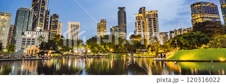 Lake in the evening, near by Twin Towers with city on background. Kuala Lumpur, Malaysia BANNER, LONG FORMAT Lake in the evening, near by Twin Towers with city on background. Kuala Lumpur, Malaysia BANNER, LONG FORMAT 120316022