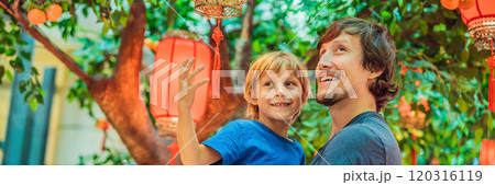 Dad and son celebrate Chinese New Year look at Chinese red lanterns BANNER, LONG FORMAT 120316119