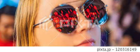 Woman celebrate Chinese New Year look at Chinese red lanterns. Chinese lanterns are reflected in glasses BANNER, LONG FORMAT 120316149