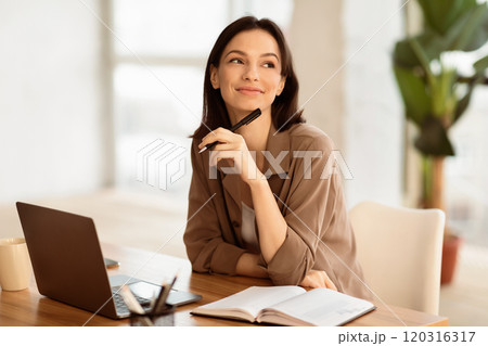 Dreaming About Vacation. Portrait of happy office worker thinking about holidays sitting at office, pondering, copyspace 120316317