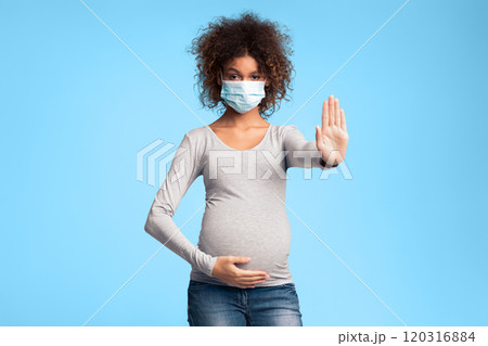 Infectious diseases and flu. Pregnant lady in medical mask gesturing stop sign, gray background 120316884