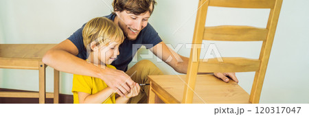 Father and son assembling furniture. Boy helping his dad at home. Happy Family concept BANNER, LONG FORMAT 120317047