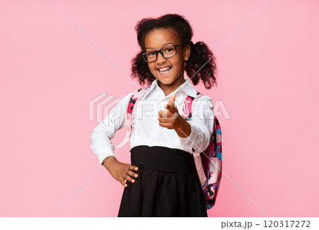 Hey, you. Cute Afro Elementary Student Girl Pointing Finger At Camera On Yellow Background In Studio. Copy Space Hey, you. Cute Afro Elementary Student Girl Pointing Finger At Camera On Yellow Background In Studio. Copy Space 120317272