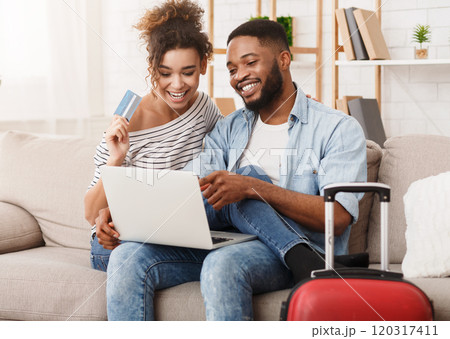 Preparation for travel. Romantic couple using laptop, booking hotel online 120317411