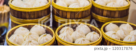 Street food booth selling Chinese specialty Steamed Dumplings in Beijing, China BANNER, LONG FORMAT 120317876