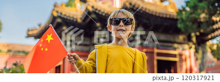 Enjoying vacation in China. Young boy with national chinese flag in Forbidden City. Travel to China with kids concept. Visa free transit 72 hours, 144 hours in China BANNER, LONG FORMAT 120317921