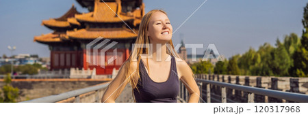 Enjoying vacation in China. Young woman in Forbidden City. Travel to China concept. Visa free transit 72 hours, 144 hours in China BANNER, LONG FORMAT Enjoying vacation in China. Young woman in Forbidden City. Travel to China concept. Visa free transit 72 hours, 144 hours in China BANNER, LONG FORMAT 120317968