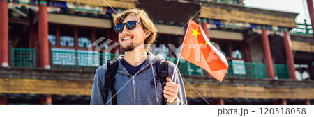 Enjoying vacation in China. Young man with national chinese flag on the background of the old Chinese street. Travel to China concept. Visa free transit 72 hours, 144 hours in China BANNER, LONG Enjoying vacation in China. Young man with national chinese flag on the background of the old Chinese street. Travel to China concept. Visa free transit 72 hours, 144 hours in China BANNER, LONG 120318058