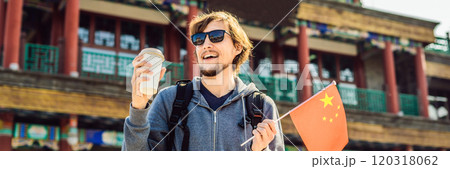 Enjoying vacation in China. Young man with national chinese flag on the background of the old Chinese street. Travel to China concept. Visa free transit 72 hours, 144 hours in China BANNER, LONG Enjoying vacation in China. Young man with national chinese flag on the background of the old Chinese street. Travel to China concept. Visa free transit 72 hours, 144 hours in China BANNER, LONG 120318062
