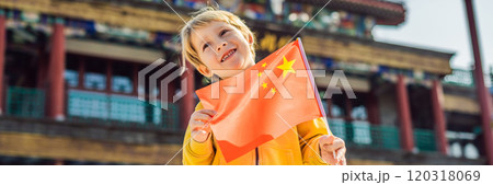 Enjoying vacation in China. Young boy with national chinese flag on the background of the old Chinese street. Travel to China concept. Visa free transit 72 hours, 144 hours in China BANNER, LONG Enjoying vacation in China. Young boy with national chinese flag on the background of the old Chinese street. Travel to China concept. Visa free transit 72 hours, 144 hours in China BANNER, LONG 120318069