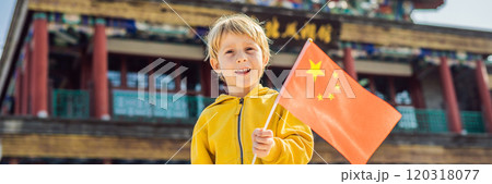 Enjoying vacation in China. Young boy with national chinese flag on the background of the old Chinese street. Travel to China concept. Visa free transit 72 hours, 144 hours in China BANNER, LONG Enjoying vacation in China. Young boy with national chinese flag on the background of the old Chinese street. Travel to China concept. Visa free transit 72 hours, 144 hours in China BANNER, LONG 120318077