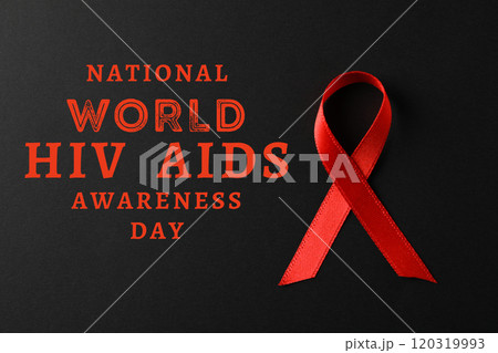 AIDS day, red ribbon on black background with text AIDS day, red ribbon on black background with text 120319993