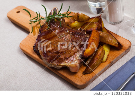 Appetizing beef steak with potatoes and rosemary 120321038