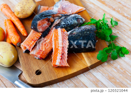 Salmon offal served with vegetables on board 120321044