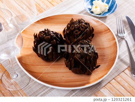 Top view of vegetarian appetizer of baked artichokes served on plate 120321261