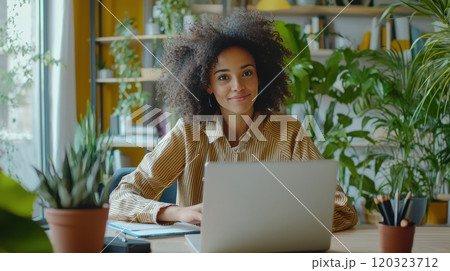 Confident Young Woman in Stylish Suit Posing Against Modern Architectural Background 120323712