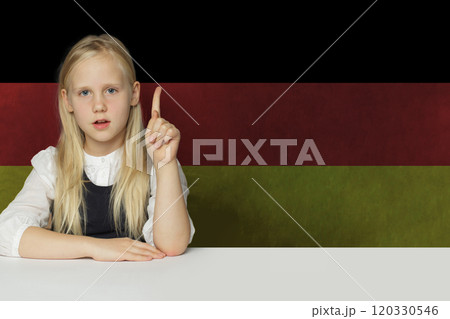 Blonde young child girl on German flag background. Education and study language in Germany concept Blonde young child girl on German flag background. Education and study language in Germany concept 120330546