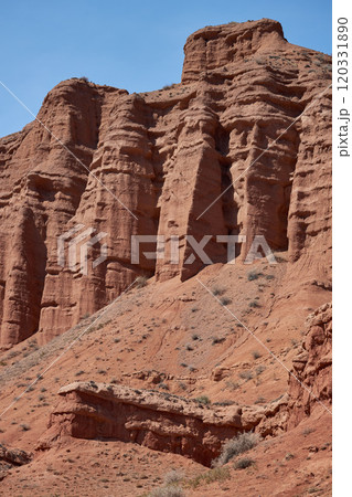 Rocky columns of red sandstone in Konorchek canyon, aeolian deposits 120331890