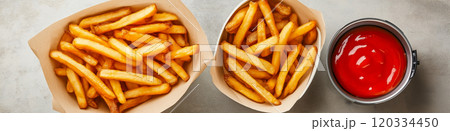 French fries. Pommes frites. Chips. French fries in a paper wrap with ketchup dip 120334450