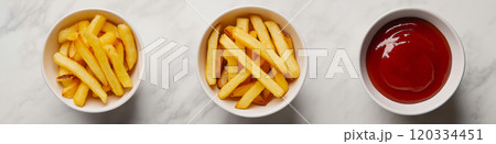 French fries. Pommes frites. Chips. French fries in a paper wrap with ketchup dip 120334451