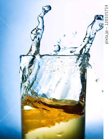 lemon drops in a glass of drink 120335714