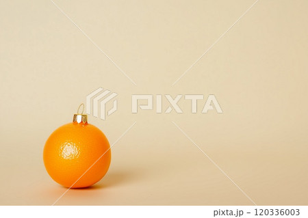 Minimal background with small orange as christmas toy ball. Copy space, Generative AI 120336003